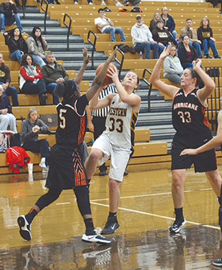 Western Brown’s Bailie Darnall shoots over a Wilmington defender  in the Lady Broncos’ season opener, Nov. 29. 