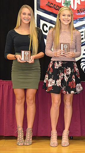 Western Brown sophomores Sophie Leto, left, and Carson Jones, right, pose with their SBAAC American Division Cross Country First Team awards after wrapping up a successful fall season. 