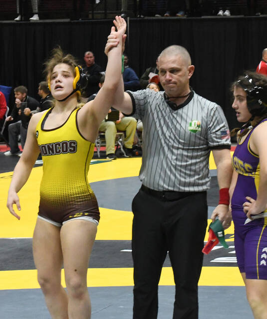 129448210_web1_Miller_stround_win1
Western Browns Abigail Miller (left) is declared the winner in her first-round match against Olive Karam of Warren Champion during the OHSAA State Wrestling Championships in Columbus. Miller won by pin in 3:27. Photo by Brian S. Peterson