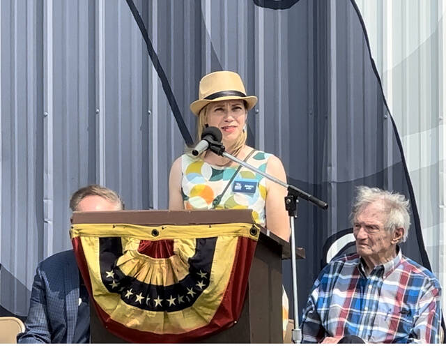 129829601_web1_IMG_9456
Megan Wood, executive director and CEO of Ohio History Connection, speaks to the crowd during the July 17 U.S. Grant barn painting dedication ceremony held on State Route 125 outside of Georgetown. Photo by Wade Linville