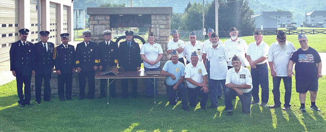 129920191_web1_Ripley-wtc-1
Members of the Ripley Fire Department Ripley American Legion Post 367 gathered for a ceremony on Monday, Aug. 21 after receiving pieces of the World Trade Center delivered by Ripley native and New York firefighter, Dillon Mussinan. Photo by Wade Linville