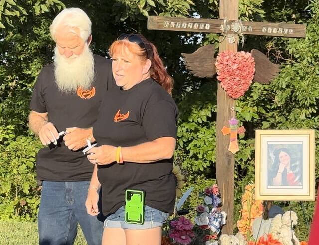 129938104_web1_IMG_9735
David and Mary Dodson, parents of Brittany Stykes, address the crowd during the annual candlelight memorial held Aug. 28, 10 years after their daughter was murdered while traveling on US Highway 68. Photo by Wade Linville