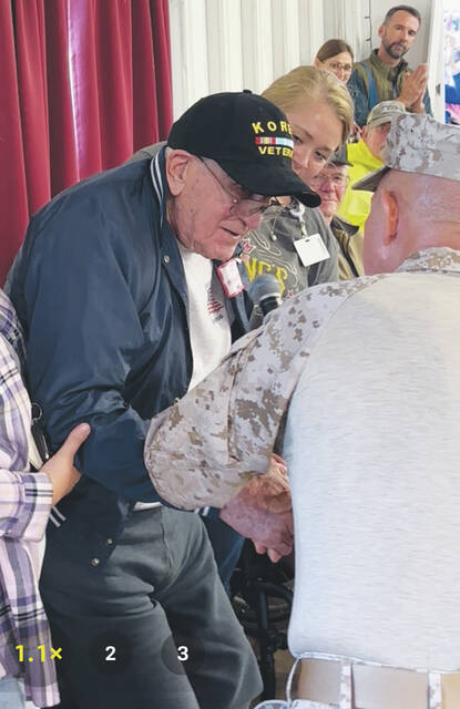 130033763_web1_bubp-and-hanselman Jim Hanselman, a 100-year-old Korean War Veteran, is recognized by Colonel Dan Bubp (U.S.M.C.R. ret.) during this years Brown County Fair Veterans Recognition Program held Sept. 28. Photo by Wade Linville