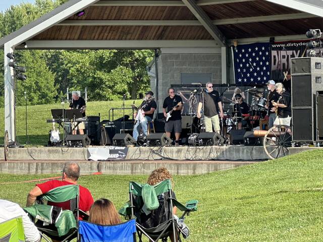 130412377_web1_music-in-park-1
Dirty Deeds (AC/DC tribute band) performs for the large crowd during the first Mt. Orab Music in the Park concert of 2024 on May 11. Photo by Wade Linville