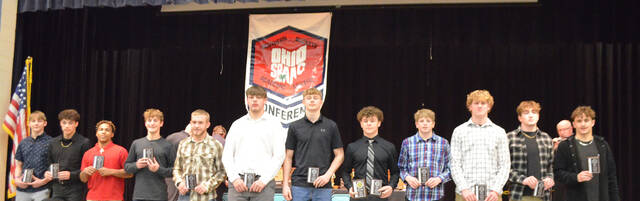 130467452_web1_American-Div.-boys-wrestling
The 2023-24 Southern Buckeye Athletic/Academic Conference American Division First Team of boys wrestling all-stars pose with their awards during the March 12 banquet. From the left, Mythias Stuckey (Wilmington), Darius Stewart (Wilmington) Josiah Puller (Wilmington), Max McCoy (Wilmington), Cadyn Denniston (Goshen), Jaden Owens (Goshen), Kash Keitz (Goshen), Gage Croley (Goshen), Conner Musser (Clinton-Massie), Brendan Musser (Clinton-Massie), Cash Mounce (Clinton-Massie), and Hunter Monds (Clinton-Massie). Not pictured are Cody Lisle (Clinton-Massie) and Elijah Groh (Clinton-Massie). Photo by Wade Linville