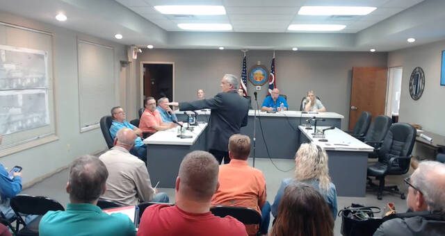 130502418_web1_IMG_0929
Jeff Klump, of K4 Stein Architecture, presents updated engineer drawings on the Freedom Landing Boat Dock project to Ripley Village Council during a special meeting held April 1. Photo by Wade Linville
