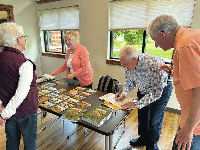 130625840_web1_IMG_1243
Author Gary Saunders signs copies of his new book Hold Your Breath: An X-Ray Technologists Vietnam MASH Experience during a book signing at the Union Township Public Library in Russellville on May 18. Photo by Wade Linville