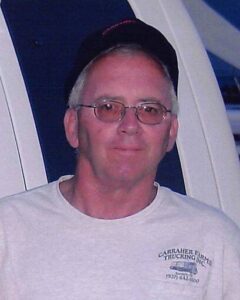 John William Carraher, 77