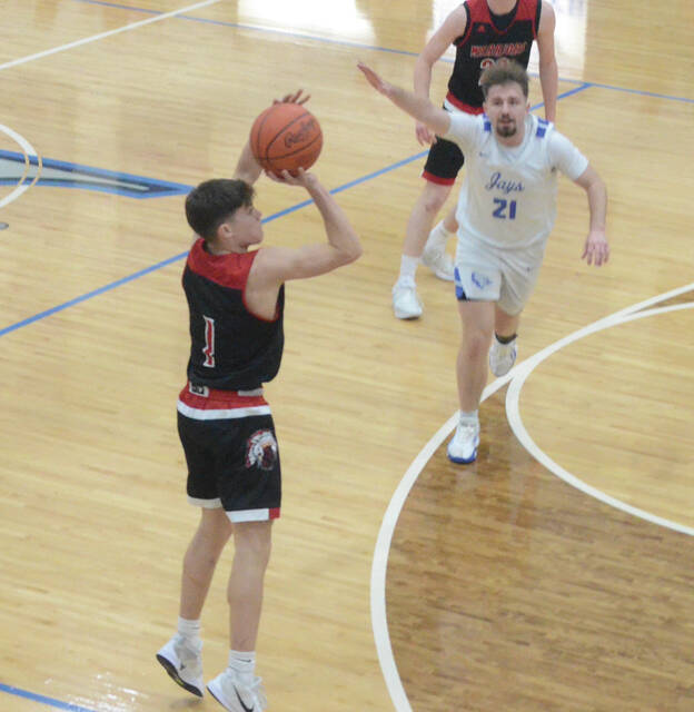 Easterns Kayne Dotson shoots from three-point land during the Warriors Feb. 19 win at Ripley. Photo by Wade Linville