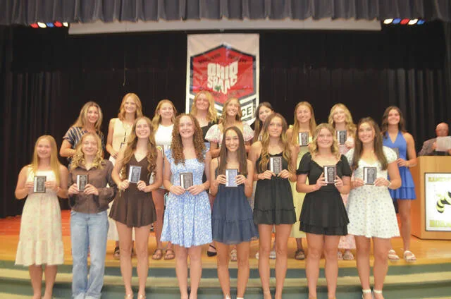 The 2026 Southern Buckeye Athletic/Academic Conference National Division First Team of girls track and field all-stars pose with their awards. Front row, from the left, Savannah Wahl (Williamsburg), Claire Moore (Williamsburg), Peyton Jones (Williamsburg), Cailee Johnson (Williamsburg), Kiera Gregory (Williamsburg), Brooklynn Gibson (Williamsburg), Makinley Fishback (Williamsburg), Emily Earley (Williamsburg), and Emily Earley (Williamsburg); back row, Reddyn Cleaver (Williamsburg), Lyla Ayers (Williamsburg), Allie Tolle (Georgetown), Lydia Johnson (Georgetown), Cinder Shaw (Clermont Northeastern), Paige Donaldson (Clermont Northeastern), Julia Best (Clermont Northeastern), Rileigh Ashley (Clermont Northeastern), and Addison Elam (Blanchester). Photo by Wade Linville
